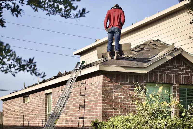 Professional roofer working on a residential roof in North Austin